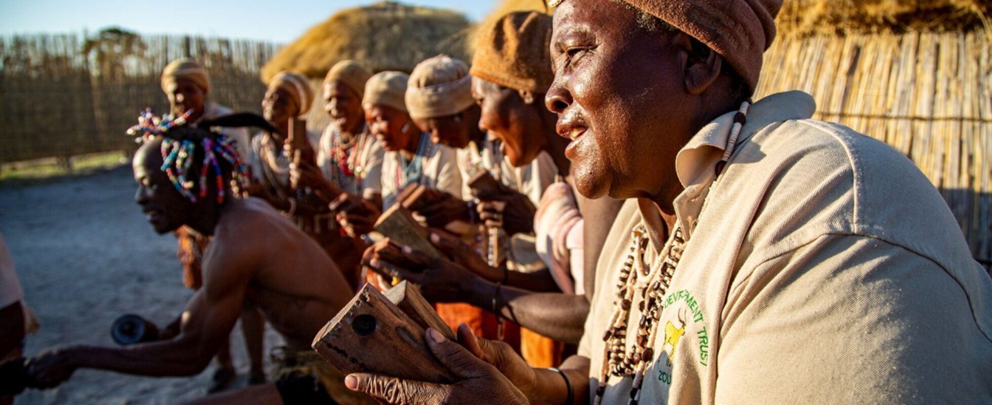 Khwai sitting in a row in a traditional village in Botswana