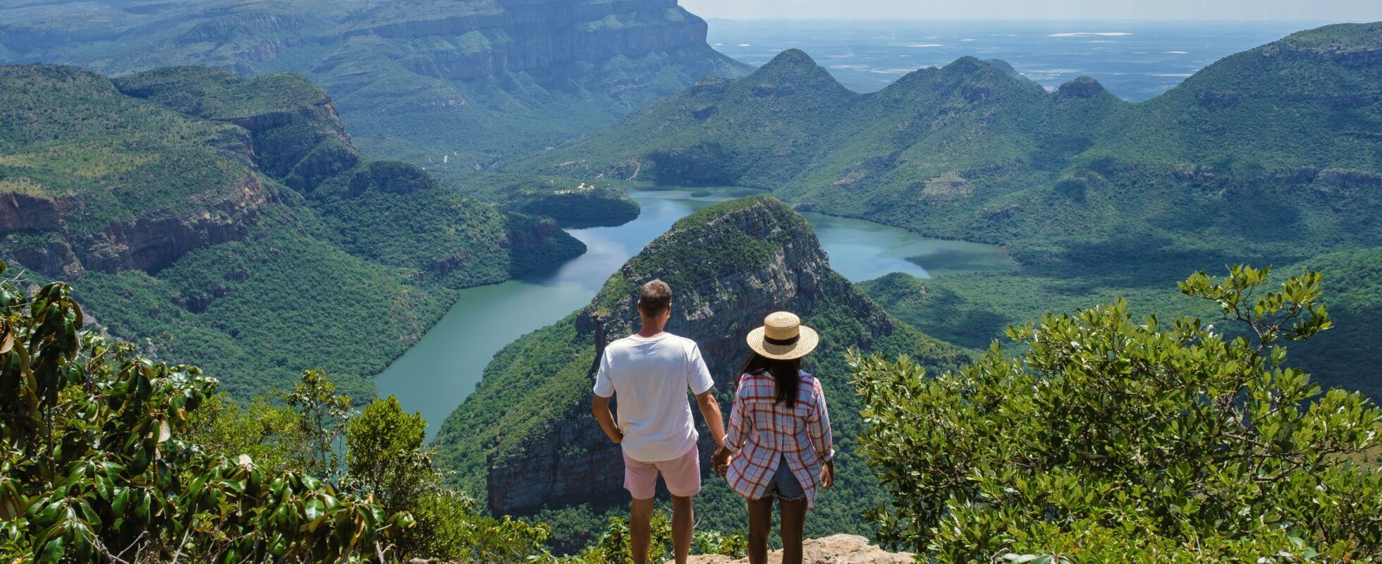 Man en vrouw die over de Blyde Canyon uitkijken